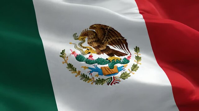 Bandera de M&eacute;xico ondeando al viento, primer plano detallado del escudo nacional para celebraciones de Cinco de Mayo, d&iacute;a de la independencia y eventos culturales patri&oacute;ticos.