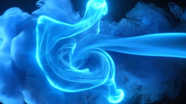 Abstract blue smoke or ink in water against a dark background, creating a dynamic and artistic visual.