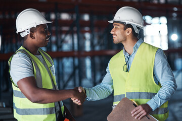 People, architect and meeting with handshake in warehouse for welcome, greeting and construction deal. Contractor, team and shaking hands for architecture agreement, partnership and storage approval © peopleimages.com
