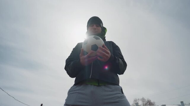 brightskinned sportsman in outdoor training session, selfassured male athlete practicing soccer in sunlight outdoors, portrait of confident man with soccer ball during outdoor practice under sunlight