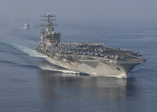 STRAIT OF HORMUZ U.S. Navy and Coast Guard ships participates in a photo exercise while transiting the Strait of Hormuz,  Sioux City is deployed to the U.S. 5th Fleet area of operations to help ensure