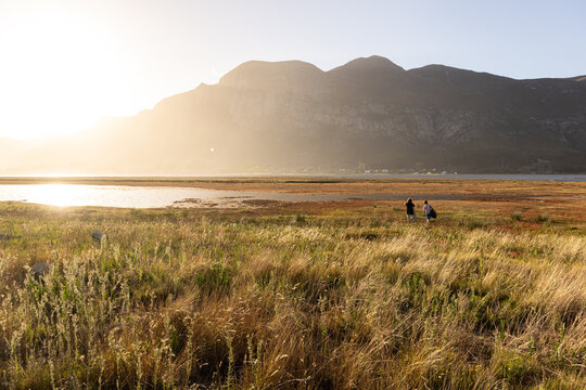 sunlight over lagoon looking toward Klein Mountains, Stanford, South Africa