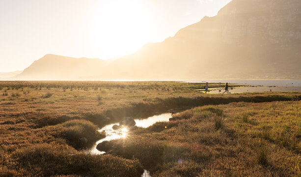 sunlight over lagoon looking toward Klein Mountains, Stanford, South Africa