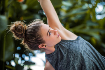 Naklejka premium Young Beautiful Woman Exercising Outdoors in Forest, Active Lifestyle and Fitness Concept Photo