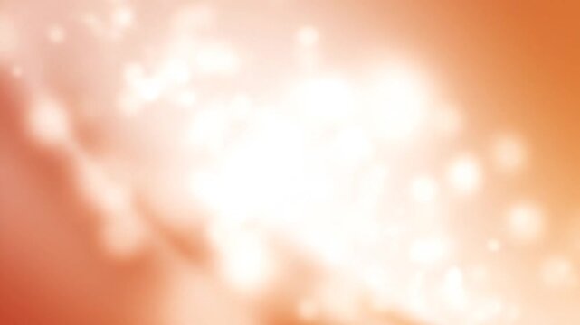 Abstract soft peach and cream gradient background with a bright central diagonal light flare, featuring out of focus white bokeh particles and smooth color transitions.