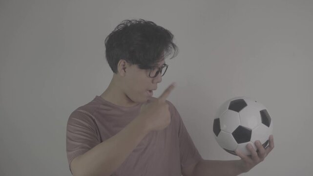 Southeast Asian people point to the soccer ball they are carrying S-Log3, S-Gamut3.Cine