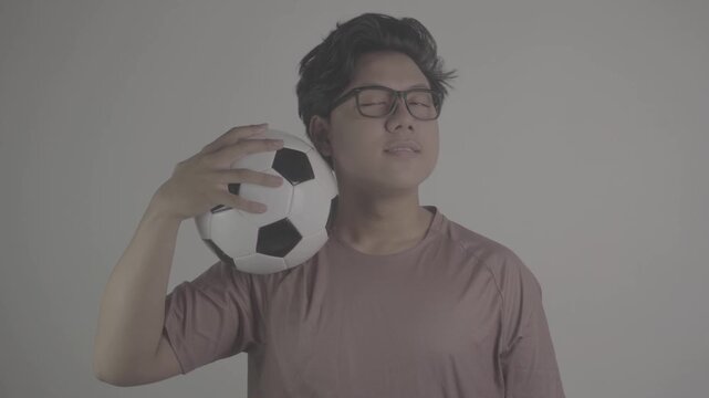Southeast Asian person is carrying soccer ball on his shoulders S-Log3, S-Gamut3.Cine