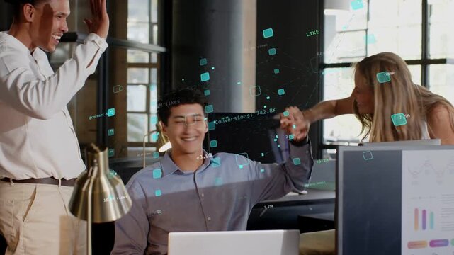 Seated user using laptop after business win, team leaning, AR charts causing high-five
