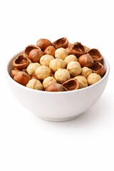 Fototapeta premium White ceramic bowl with cracked hazelnut shells and kernels isolated on white baking ingredient concept