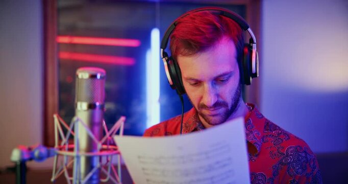 Mic, man and thinking with paper for singer, music production and lyrics for practice. Media agency, inspiration and male person with tech for musician notes, studio recording audio or song draft