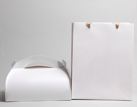 White paper lunch box and bag on a white background