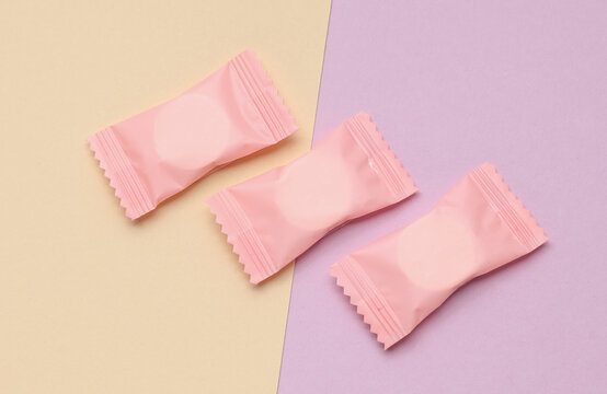 Pink candy packs mockup on pastel background
