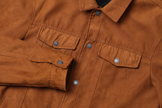 Tobacco colored suede jacket details. Men's style.