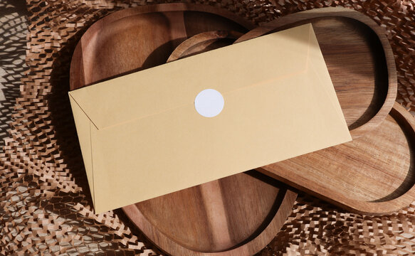 Envelope with sticker on wooden trays