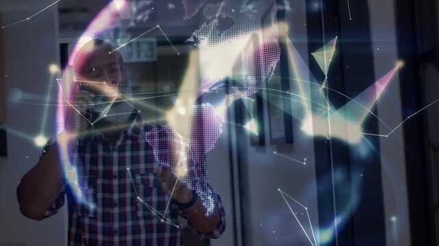 Man speaking on phone and gesturing, network graphics rising forming business data globe around him