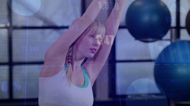 Exerciser performing overhead reach on cue, lowering arms and smiling while HUD tracking progress