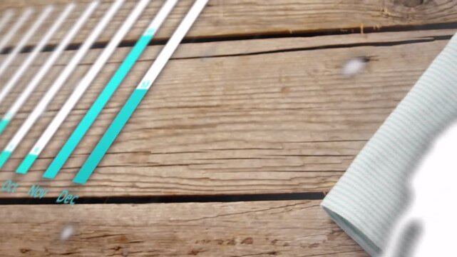 Camera panning over top revealing bowl and napkin while teal charts expanding over bowl for food