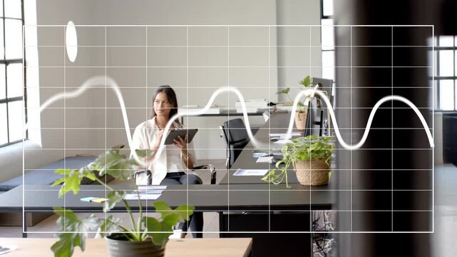 Camera shifting revealing woman tapping tablet while waveform animating across glass for business