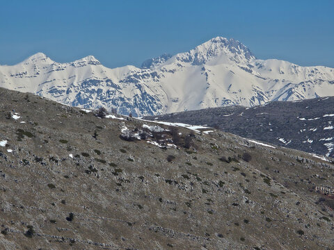 Panoramic Winter View of Gran Sasso Massif with Snow-Covered Corno Grande Peak and Rocky Mountain Slopes in Abruzzo Italy