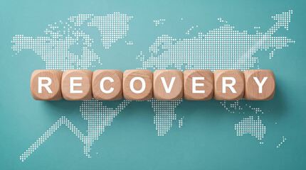 Naklejka premium Wooden blocks with the word recovery on a dotted world map background