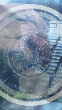 Vertical video: Right hand nearing keys causing HUD globe while pressing sliding showing net data