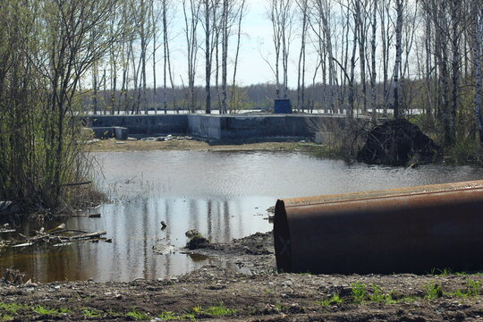 Careless attitude towards nature. Uprooted trees, flooded forests, pollution and industrial waste products of oil refining. Extraction of minerals by open method.