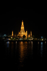 Wat Arun, also known as the Temple of Dawn, stands on the Chao Phraya River in Bangkok, Thailand © poonotsuke