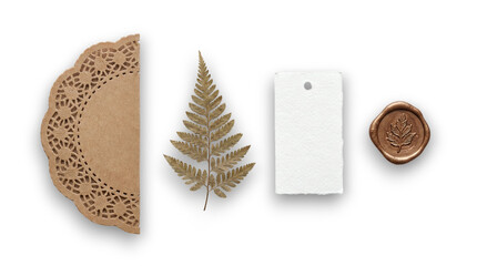 Vintage botanical flat lay with kraft doily gold fern leaf blank paper tag and bronze wax seal on a transparent background © Vitalo4ok