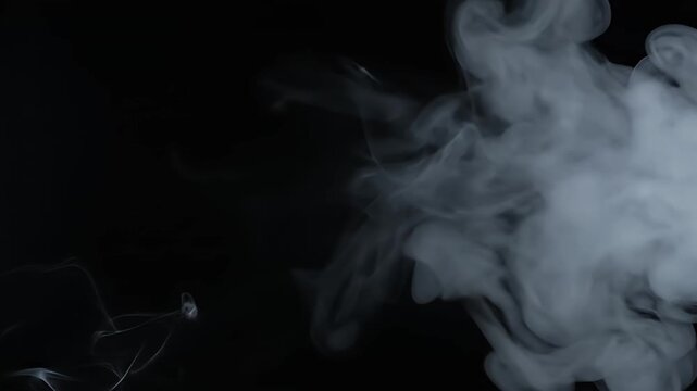 Abstract white smoke cloud against dark black background