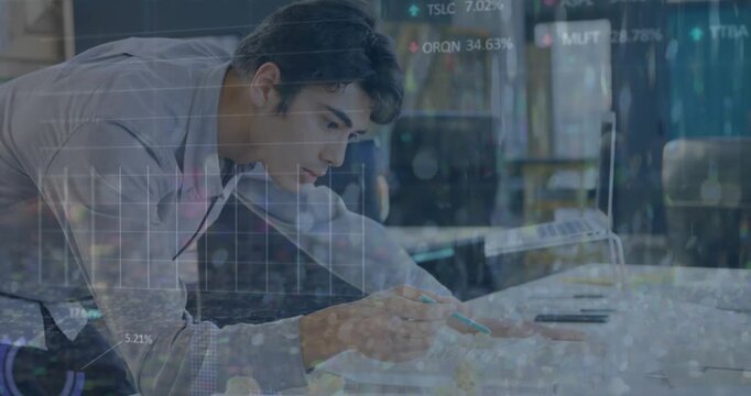 Animation of falling abstract patterns and trading board over asian architect reviewing model
