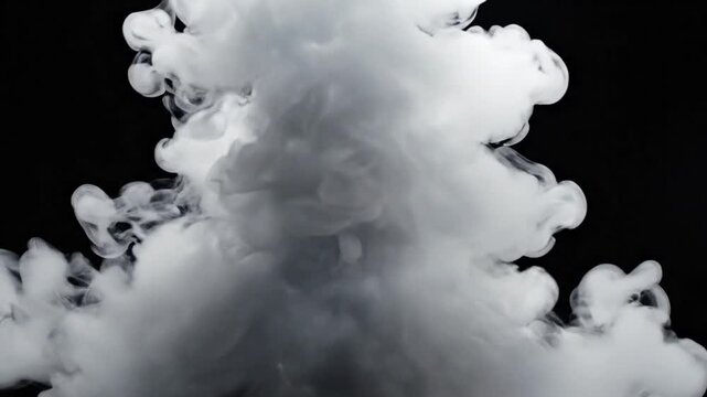White smoke cloud explosion on a black background abstract.