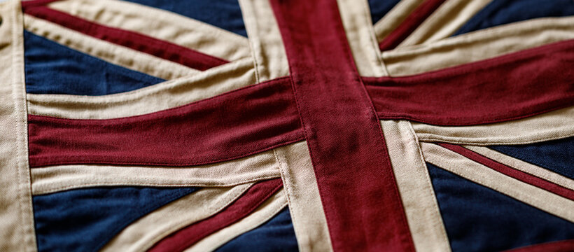 Close-up of a vintage British Union Jack flag made of high-quality stitched cotton fabric.