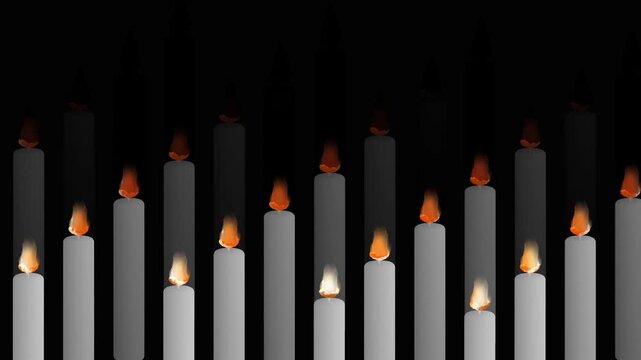 Row of white candles burning with orange flames against a dark black background in a peaceful sequence representing mourning hope and spiritual memory