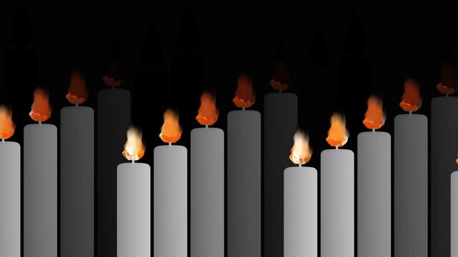 Close up view of burning white candles with glowing orange flames arranged in a pattern on a black backdrop for meditation and solemn remembrance