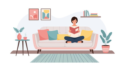 Fototapeta premium Woman reading a book on a comfortable sofa.