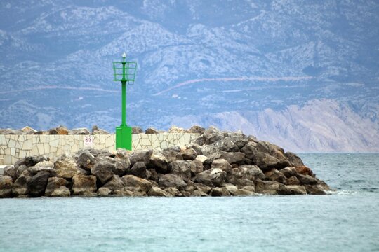 The pier in Baska in overcast weather, Krk Island, Croatia