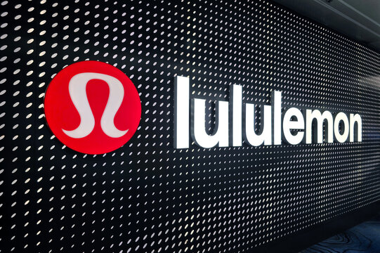Changi, Singapore - Jan 14, 2026: Large illuminated Lululemon logo and branding on a decorative wall at the departure transit hall of Changi Airport.