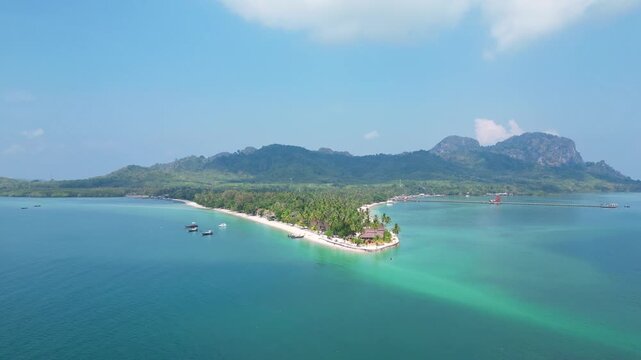 Koh Muk, Thailand: Aerial revealing drone footage of the dramatic landscape and turquoise waters of the famous Koh Mook island in the Andaman sea in Trang province in southern Thailand. 