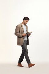 Naklejka premium Male walking holding book footwear standing reading.