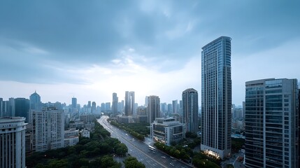 Obraz premium Panoramic view of a modern metropolis featuring towering skyscrapers and wide boulevards under a dramatic twilight sky