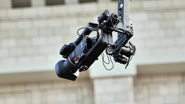 Professional video camera on a jib arm filming an event for broadcast production