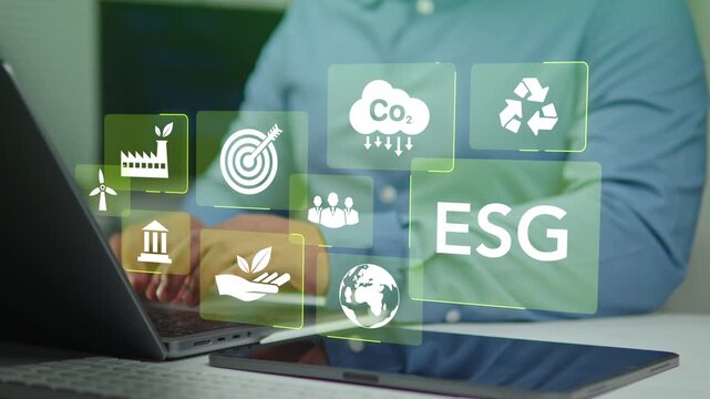 Businessman Using Computer to Analyze ESG Investment in Environmental, Social, and Governance. ESG Concept for Sustainable Green Business Strategy
