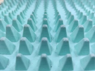 Obraz premium macro texture of blue spiked surface in perspective, repeating elements, modern abstract pattern, sharp detail 