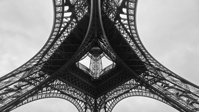 Eiffel Tower underside symmetrical view, abstract architectural pattern in Paris