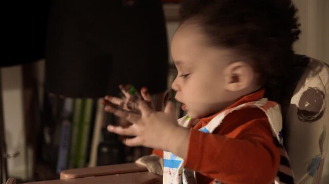 young child is playing with paint