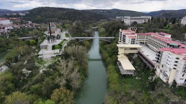 Aerial drone shot over Yantra river and Asenevtsi monument in Veliko Tarnovo, Bulgaria