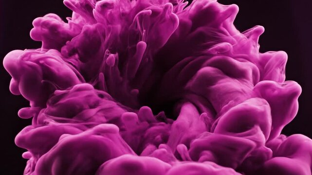 Abstract purple ink cloud in water against a dark backdrop