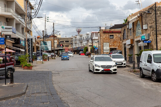 Shops and cars on a street in downtown Jibeil. Lebanon