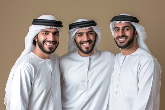 3 Middle eastern men in thawb smiling people adult.