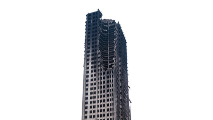 Isolated burnt-out and destroyed skyscraper with exposed concrete structure of a tall building.